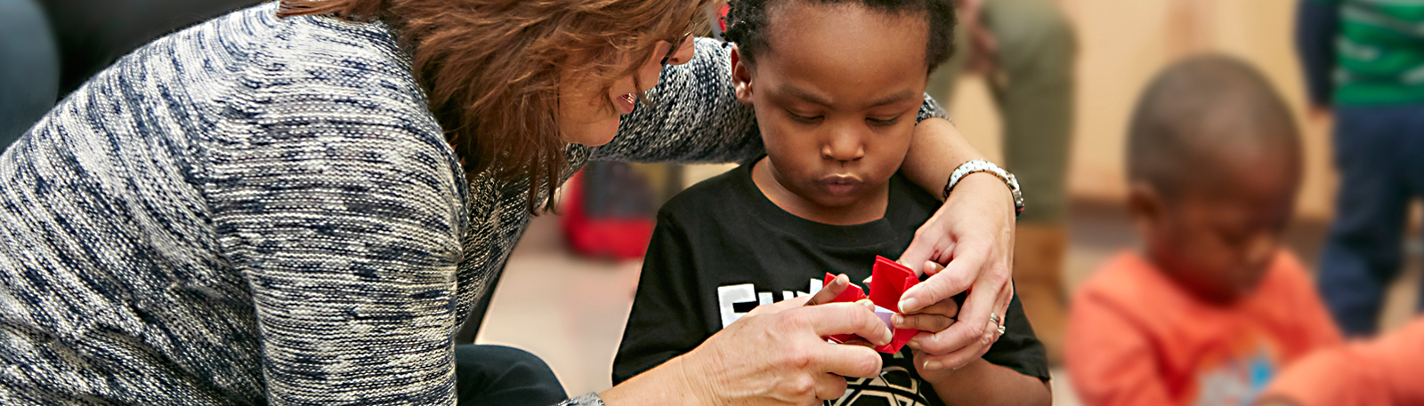 A therapist works with a child in the Child and Family Therapy Center at Kennedy Krieger.