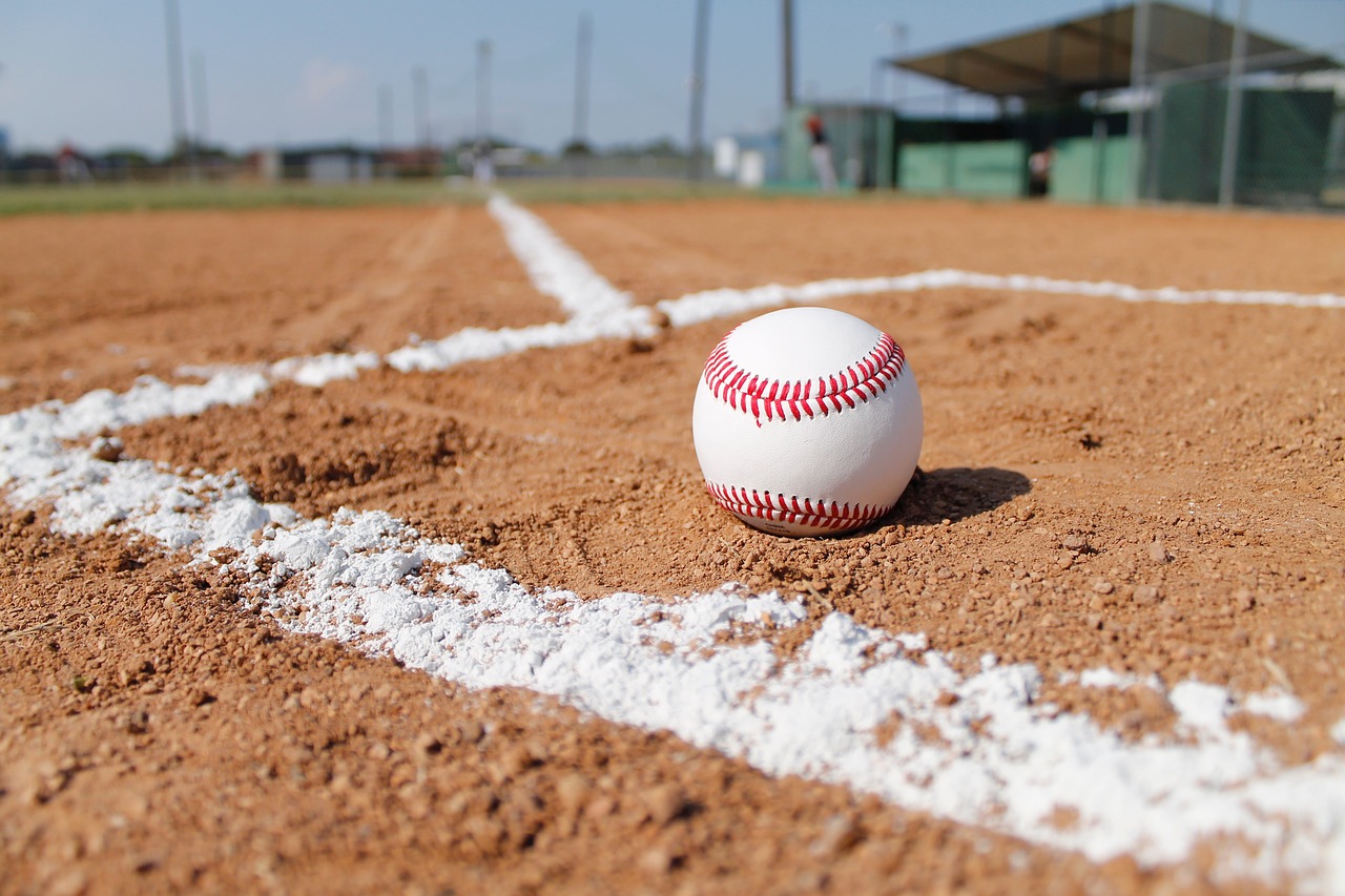 A baseball sits on a baseball field