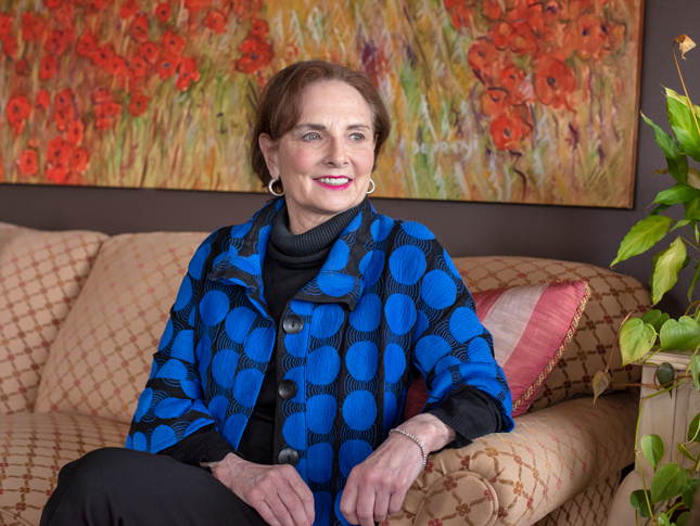A photo of Lainy LeBow-Sachs sitting on a couch