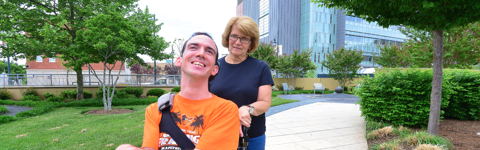A photo of Kevin DiLegge and his mom on a sidewalk