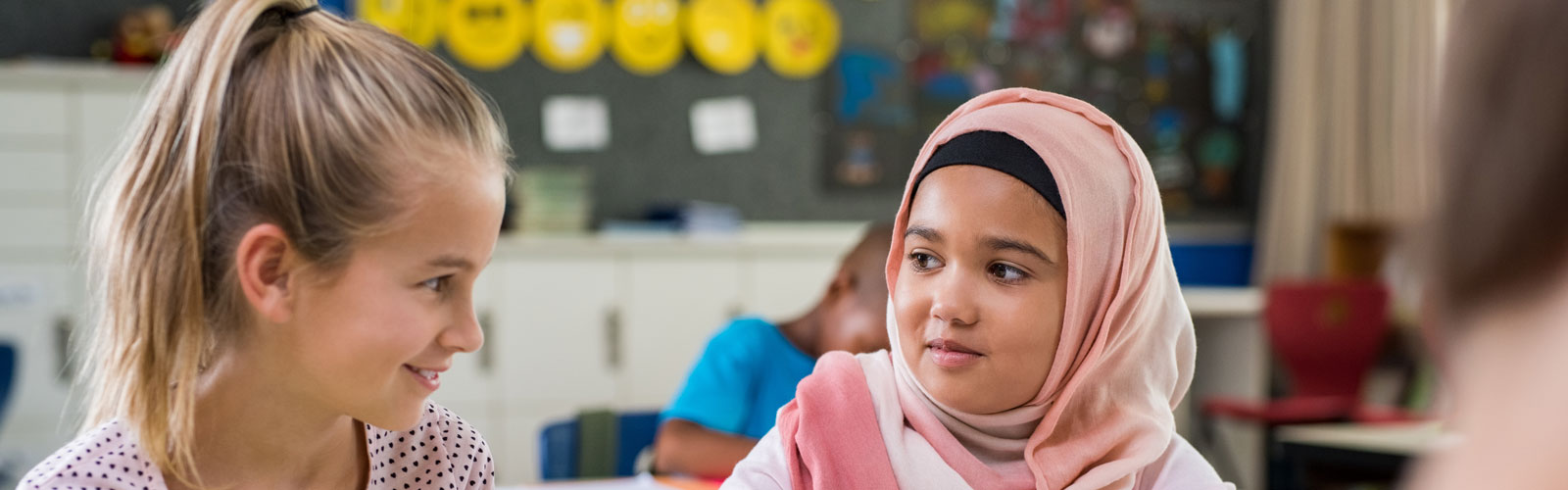 Two young girls in school.