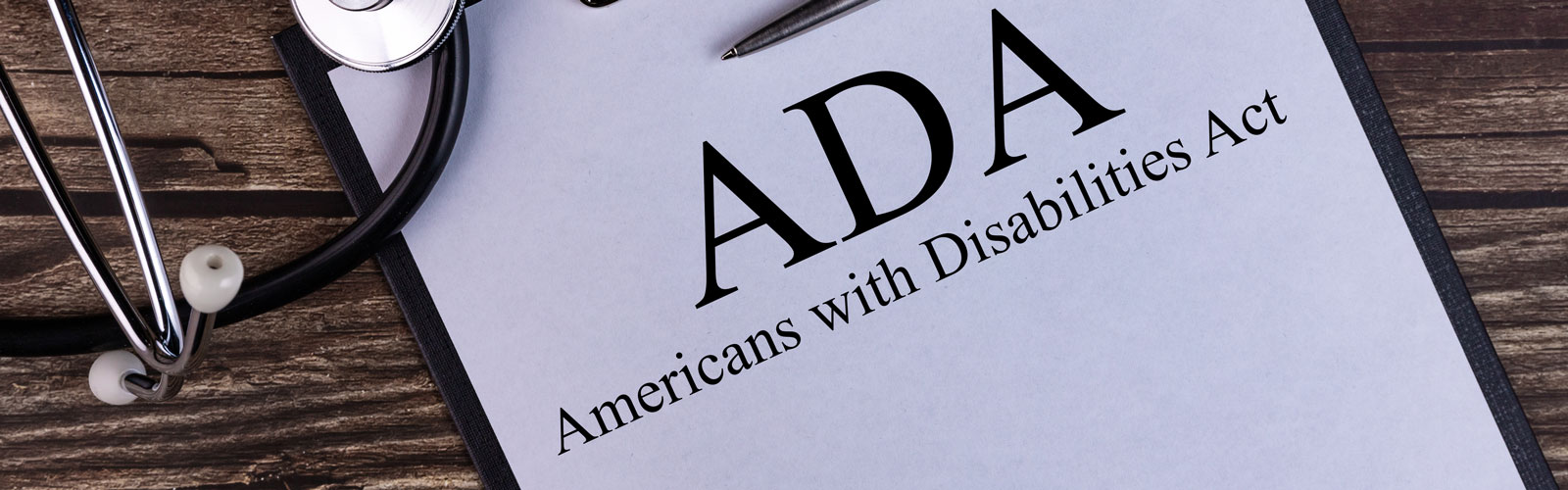 Paper on clipboard, with typed title ADA (Americans with Disabilities Act). 