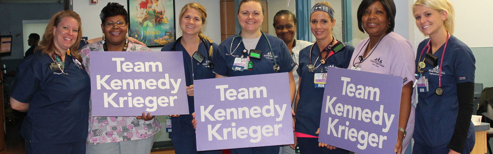 A group of nurses standing in a row. 