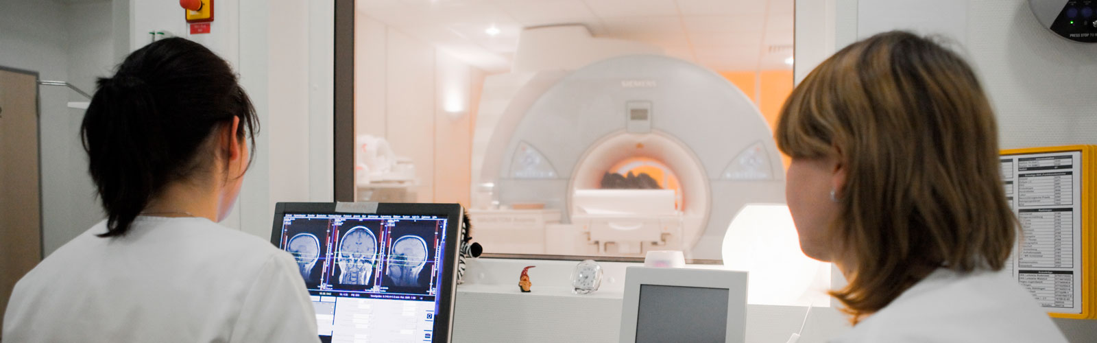 Nurses look at results of an MRI. 