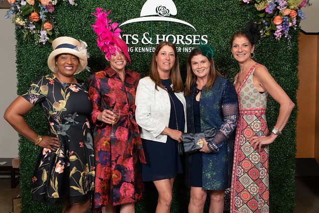 Five women pose for a photo at Hats & Horses 2022