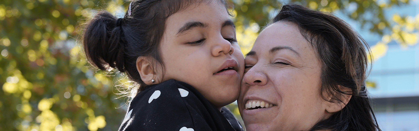 Violet hugs her mom, Inez.