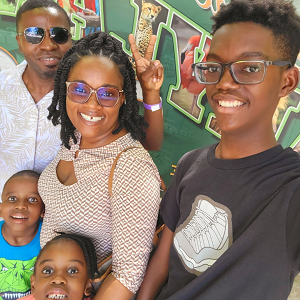 A photo of Elijah and Mason with their parents and sister.