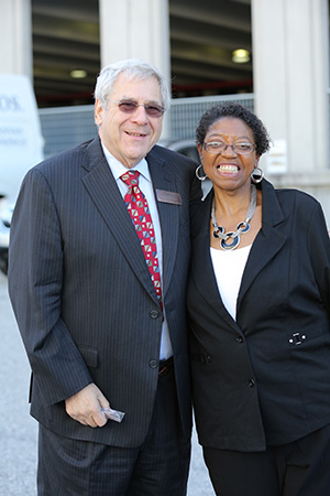 Dr. Goldstein and a guest smile for a photo.