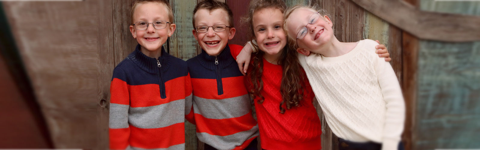 A group of children smiling.