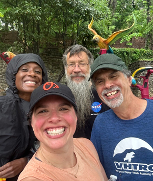 Glenn in a group selfies with a man and two women at ROAR for Kids.