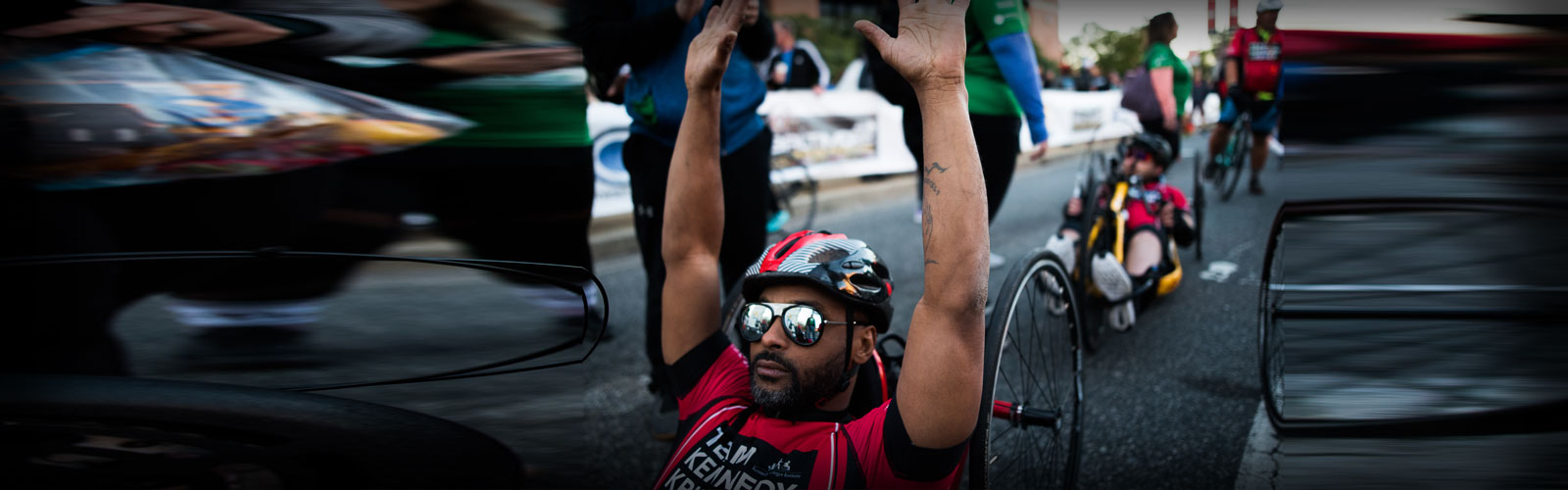 Baltimore Running Festival Biker on finish line.