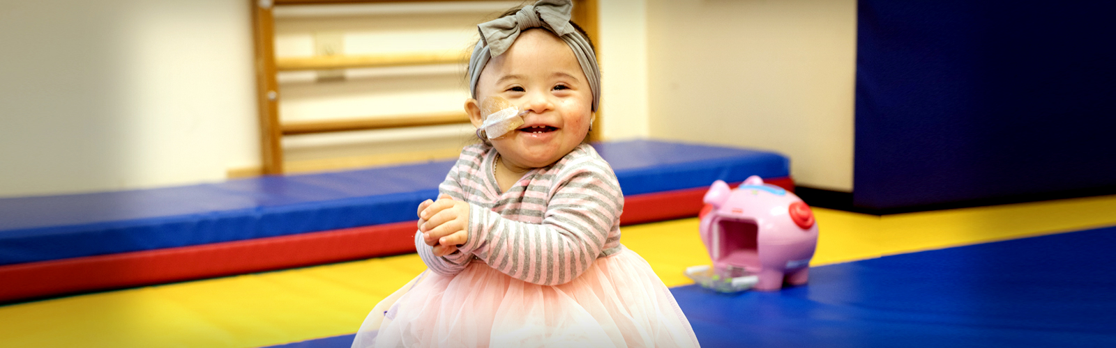 A young child smiling.  