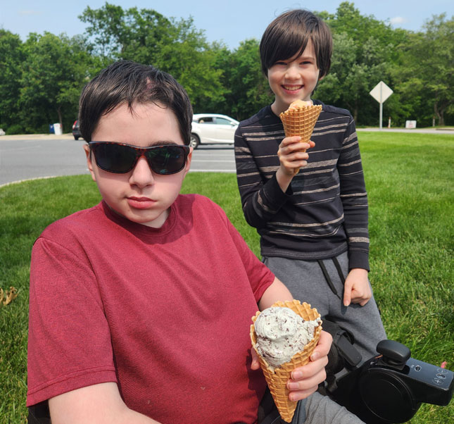 Seamus and his brother eating ice cream cones.