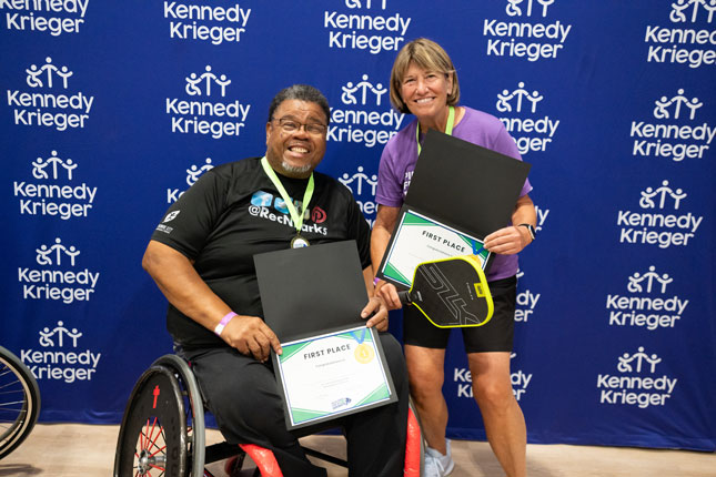 Winners of the 2025 Pickleball for All tournament hold their certificates.