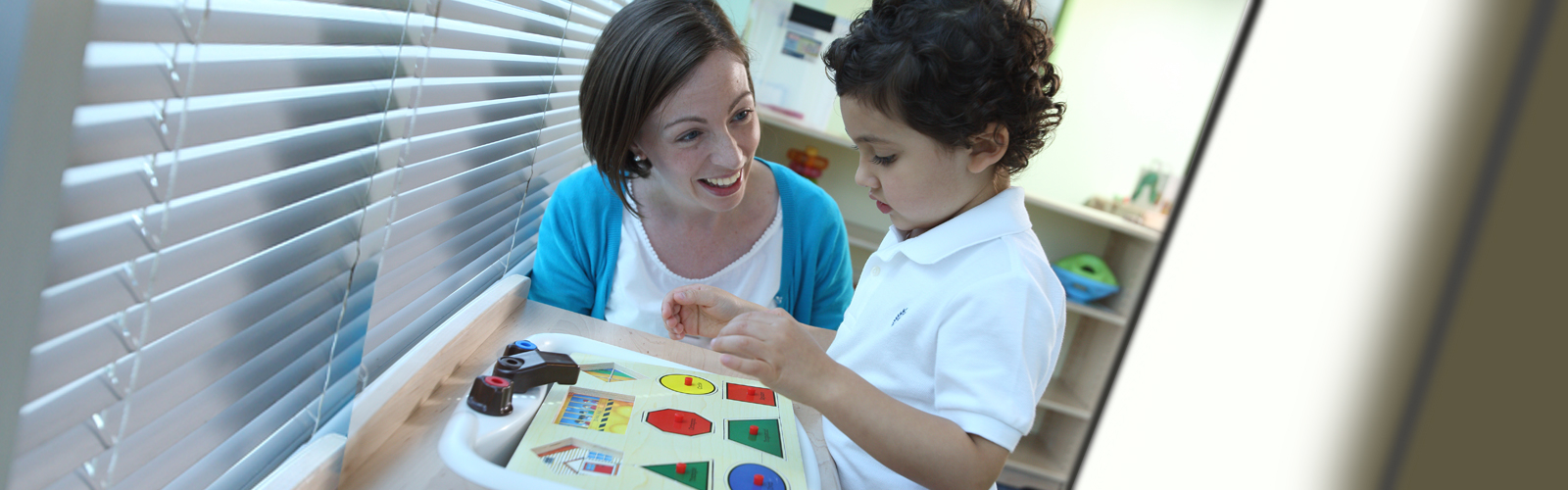 Therapist and Child at the Center for Autism.