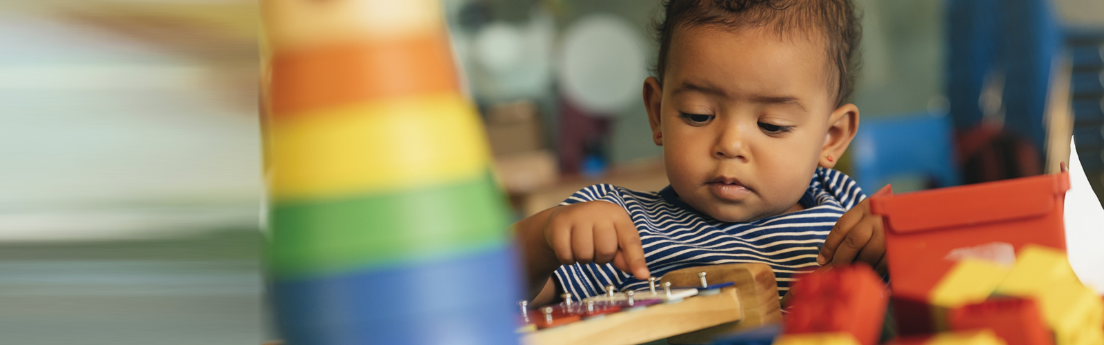 A young child plays with toys.