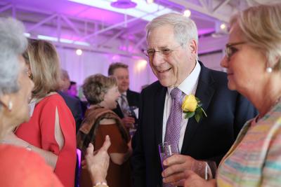 Dr. Goldstein greeting someone at the celebration.