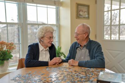 Barbara and Ron Walcher do a puzzle