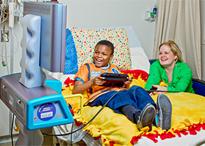 Boy enjoys using the Starlight Fun Center