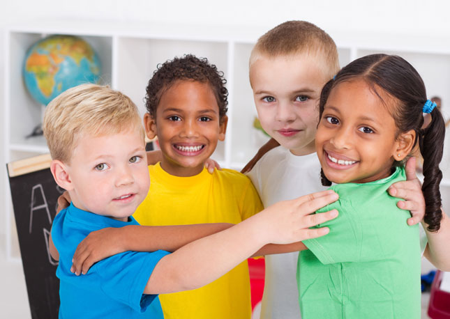 Four children in a pre-k classroom