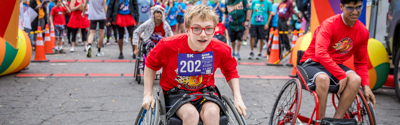 Bennett Blazers adaptive sports athletes cross the finish line at ROAR.