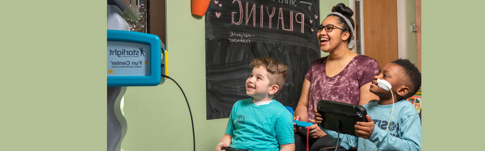 three children playing a learning game