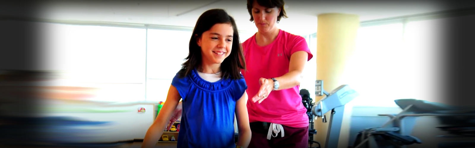 Therapist and patient in a Kennedy Krieger gym