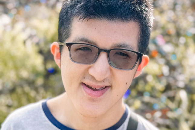 A Neurodiversity at Work participant smiles.