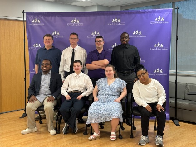 Eight graduates of Project SEARCH at the 2024 graduation.