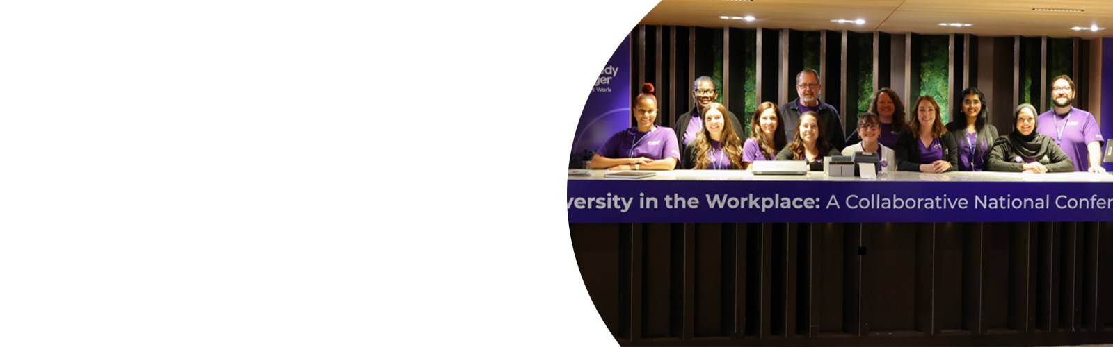The Neurodiversity at Work team poses for a photo at the conference check-in table.