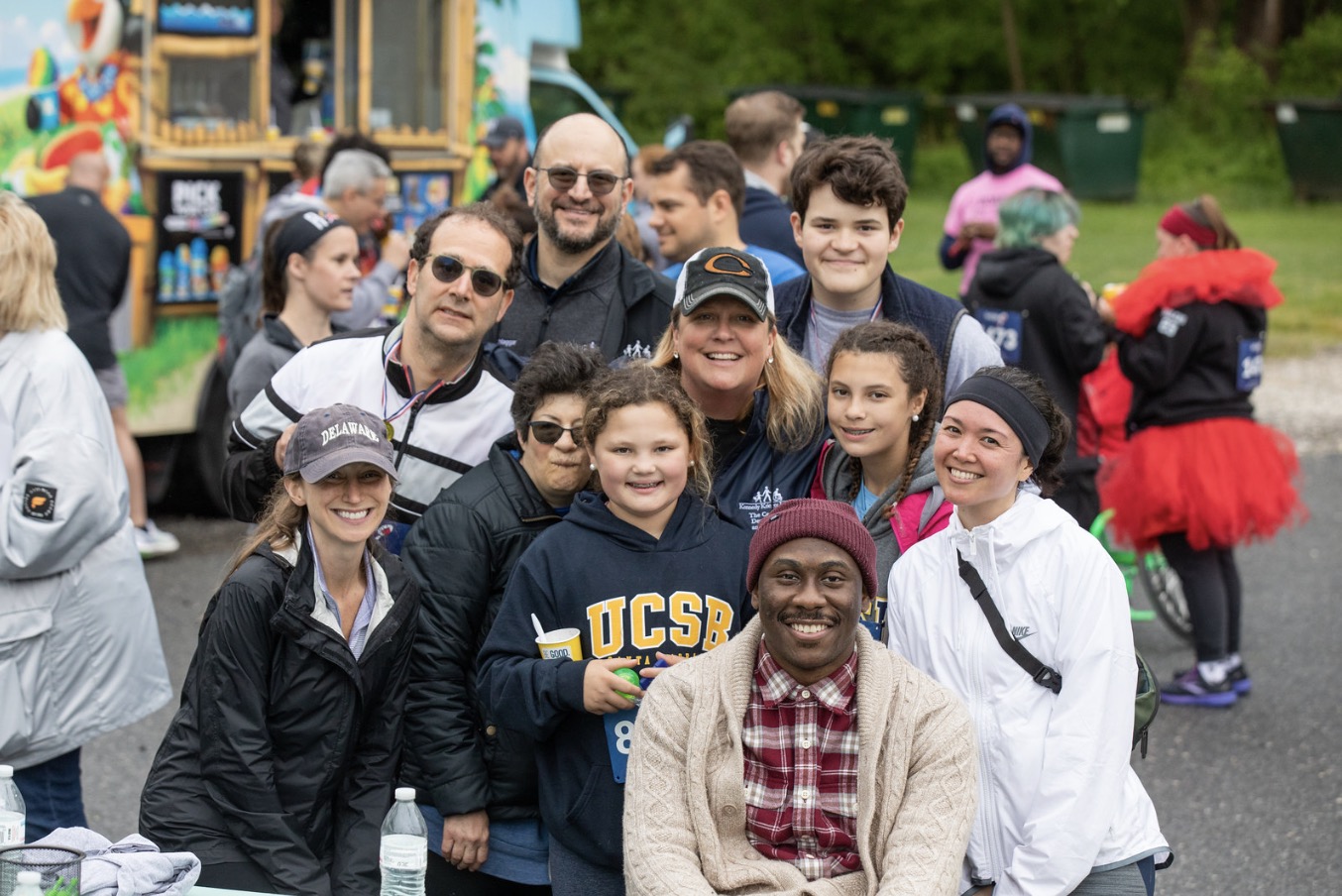 MCDD staff members, members of the community and Kennedy Krieger Institute president and CEO Dr. Bradley Schlaggar pose for a group photo at ROAR.
