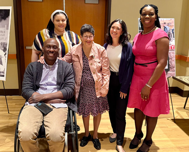 Mason-Hale, Nellenbach, Dr. Ofonedu  and two other attendees of the From Protest to Progress in a group photo.