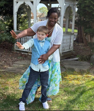 Stella and Jasper stand in front of a gazebo.