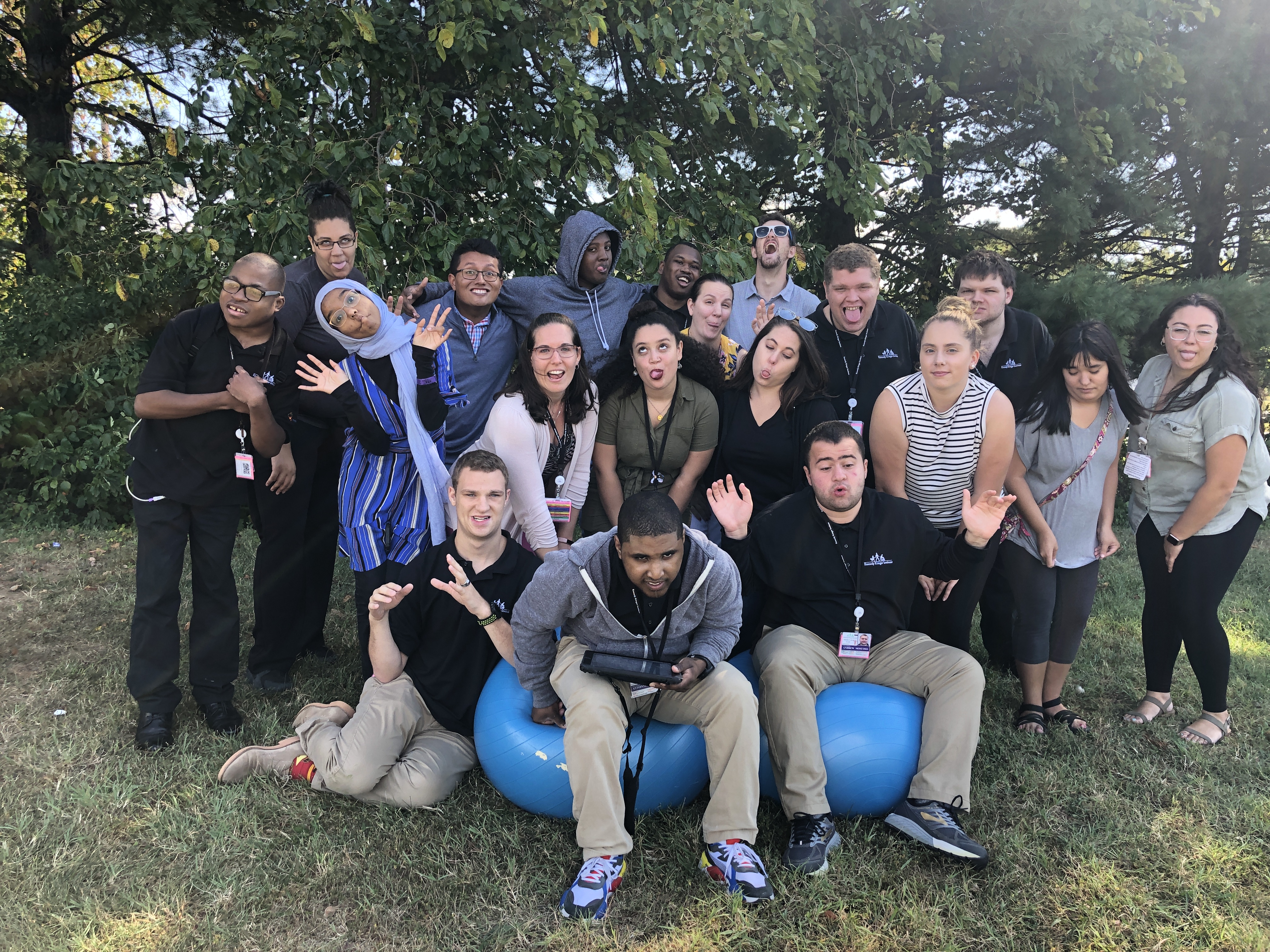 A group of participants making silly faces