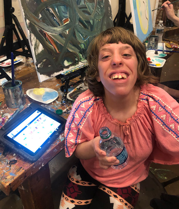 A participant at CORE Foundations Community Programming paint night.