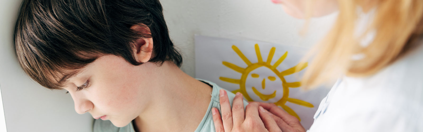 Distressed child being calmed by doctor. 