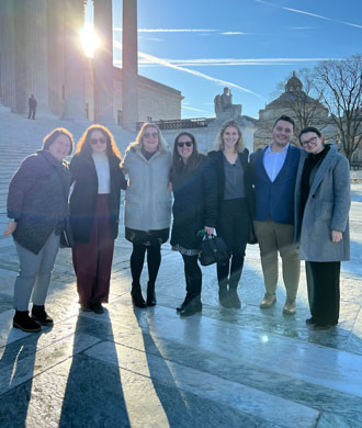 Members of the MCDD team outside of the United States Supreme Court building.