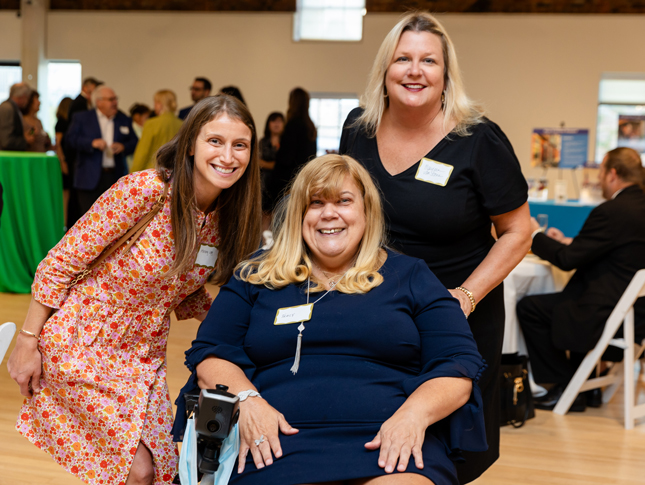 Three women pose for a group photo at the Breaking Barriers Awards Gala