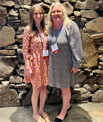 Mallory Legg and Maureen van Stone smile in a photo at the Special Needs Alliance conference.