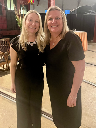 Maureen van Stone and another woman smile in a photo at the Employee Service Awards Ceremony.