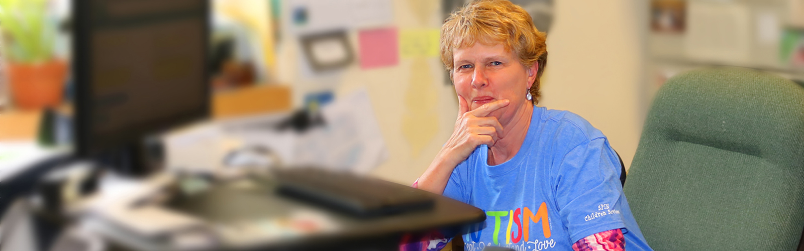 An administrator sits at her desk.