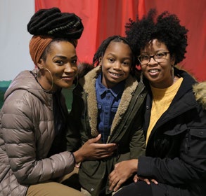 A family at Festival of Trees.