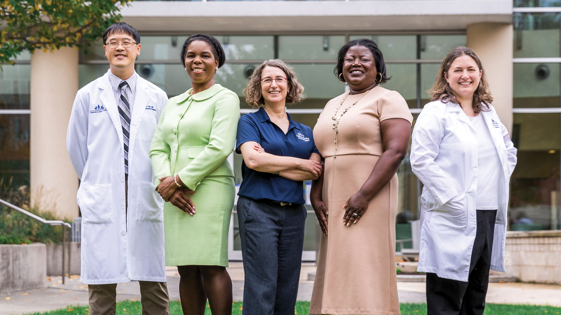 A group of doctors stand in Kennedy Krieger Institute's therapy garden.