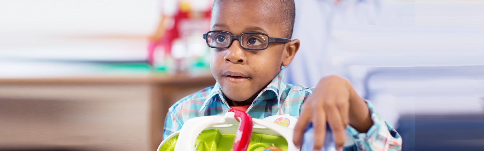 Toddler playing in Center for Autism lobby