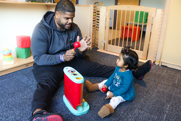 A father plays with his daughter