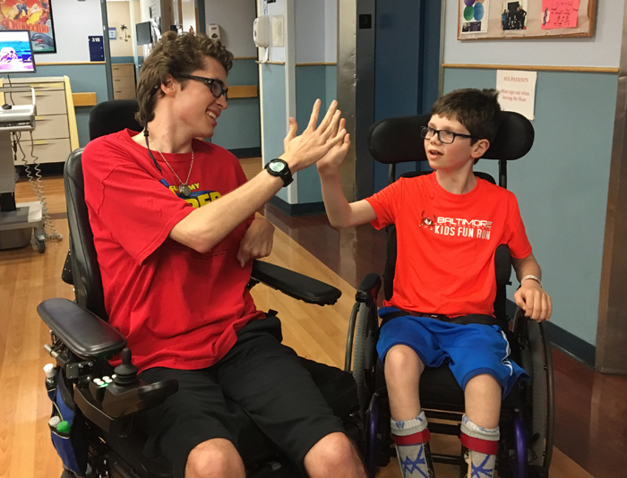 Greg and Garrett, patients, high fiving.