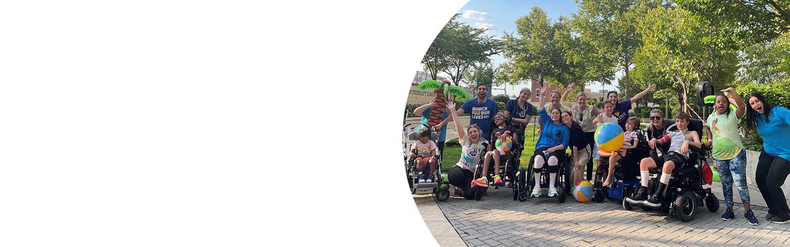 Members of the Child Life and Recreation Therapies team with patients during an event in Kennedy Krieger's Therapy Garden.