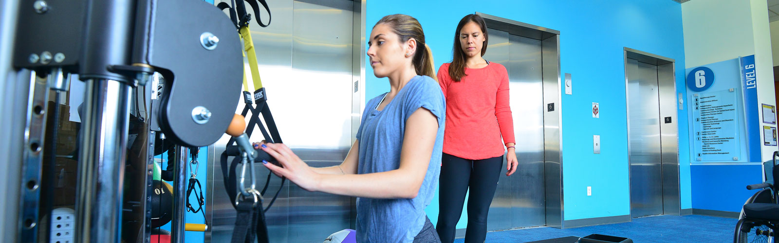 A patient using a machine to help with spinal cord injury.