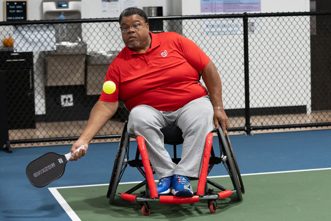 An adaptive athlete participates in Pickleball for All.