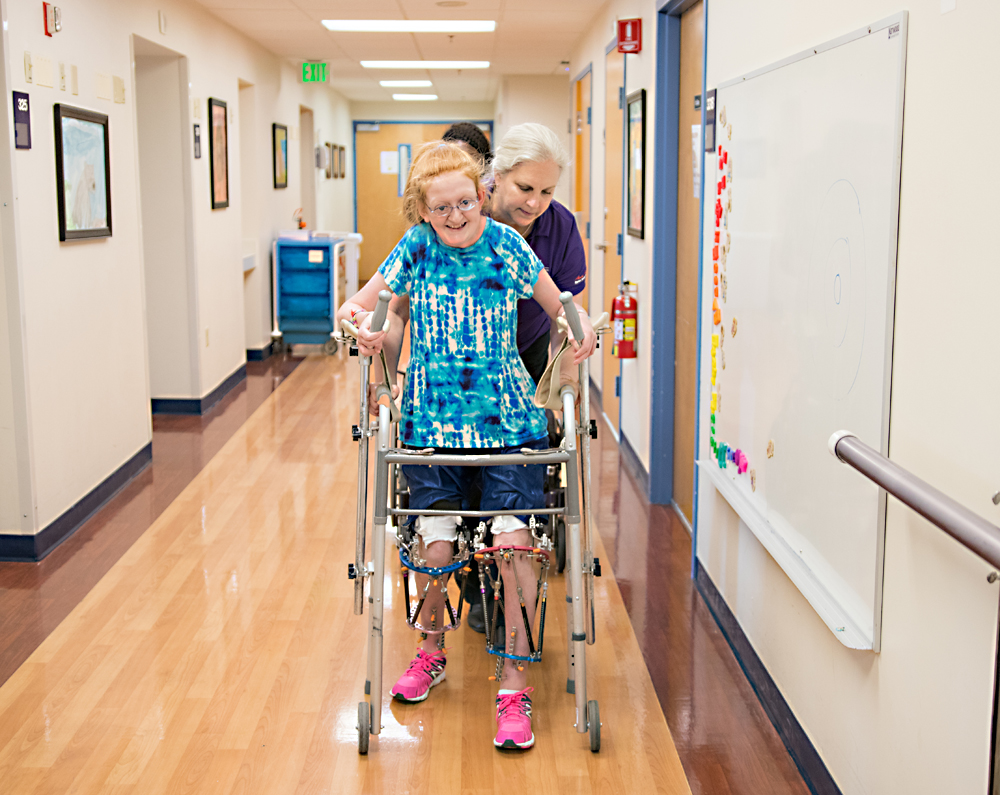 A rehabilitation patient learning to walk again.